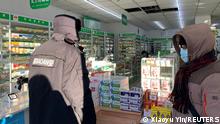 FILE PHOTO: People wait to purchase medicine at a pharmacy, amid the coronavirus disease (COVID-19) outbreak, in Beijing, China December 16, 2022. REUTERS/Xiaoyu Yin/File Photo