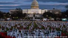 The U.S. Capitol is seen behind a vigil honoring Iranians allegedly killed by their government during a rally in support of the ongoing protests in Iran at the National Mall on Saturday, Dec. 17, 2022, in Washington. (AP Photo/Nathan Howard)