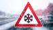A sign warning of snowy and icy conditions on the highway A sign warning of snowy and icy conditions on the highway