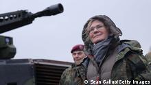 MUNSTER, GERMANY - FEBRUARY 07: German Defence Minister Christine Lambrecht stands next to a Puma infantry fighting vehicle as she attends a demonstration of capabilities of the 9th Panzer Training Brigade during a visit to the Bundeswehr Army training grounds on February 07, 2022 in Munster, Germany. Lambrecht confirmed today that Germany will send additional Bundeswehr troops to Lithuania, where it leads a NATO contingent. NATO member countries have been sending troops and military hardware to NATO member countries across eastern Europe as a signal that it is taking the current Russian troop buildup on the Russian and Belarusian borders to Ukraine seriously. The buildup has caused international fears of a possible, imminent Russian invasion of Ukraine. (Photo by Sean Gallup/Getty Images)