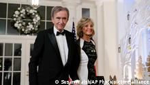 Bernard Arnault, Chairman and CEO of LVMH Moët Hennessy, and his wife Helene Mercier-Arnault arrive for the State Dinner with President Joe Biden and French President Emmanuel Macron at the White House in Washington, Thursday, Dec. 1, 2022. (AP Photo/Susan Walsh)