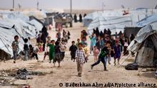 FILE - Children gather outside their tents, at al-Hol camp, which houses families of members of the Islamic State group, in Hasakeh province, Syria, May 1, 2021. U.S.-backed Syrian fighters said Saturday, Sept. 17, 2022, they have concluded a 24-day sweep at operation at a sprawling camp in northeast Syria housing tens of thousands of women and children linked to the Islamic State group. (AP Photo/Baderkhan Ahmad, File)