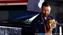 Soccer Football - Argentina team arrives to Buenos Aires after winning the World Cup - Buenos Aires, Argentina - December 20, 2022
Argentina's Lionel Messi with the trophy during the team's arrival at Ezeiza International Airport REUTERS/Agustin Marcarian