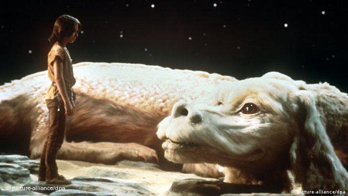 Film still NeverEnding Story, a boy and a dragonlike creature 