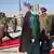 Afghan President Hamid Karzai arrives to open the new parliament in Kabul