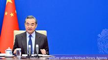 (221220) -- BEIJING, Dec. 20, 2022 (Xinhua) -- Chinese State Councilor and Foreign Minister Wang Yi, also a member of the Political Bureau of the Communist Party of China (CPC) Central Committee, meets with French Foreign Affairs Minister Catherine Colonna via video link, Dec. 19, 2022. (Xinhua/Yin Bogu)