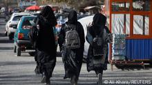 Afghan female students walk near Kabul University in Kabul, Afghanistan, December 21, 2022. REUTERS/Ali Khara