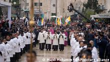 Latin Patriarch Pierbattista Pizzaballa in Manger Square, adjacent to the Church of the Nativity, traditionally believed to be the birthplace of Jesus Christ, in the West Bank town of Bethlehem during Christmas , Saturday , Dec. 24, 2022. (AP Photo/Majdi Mohammed)