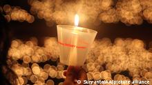 SURABAYA, INDONESIA - DECEMBER 25 - Christians pray and light candles during a Christmas celebration mass at Bethany Church, Surabaya, East Java, on December 25, 2022. Suryanto / Anadolu Agency