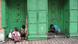 Indian child Rita Chakroborty (2L) is accompanied by her mother Jotsna (L) as she studies her school books in a doorway of a shop in Kolkata on August 2, 2009, while a drug addict takes heroin nearby. Indian child Rita Chakroborty (2L) is accompanied by her mother Jotsna (L) as she studies her school books in a doorway of a shop in Kolkata on August 2, 2009, while a drug addict takes heroin nearby.