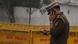 Close shot of an Indian police officer using his cellphone in New Delhi, India, 2019 Close shot of an Indian police officer using his cellphone in New Delhi, India, 2019