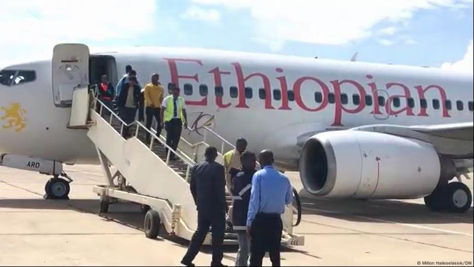 Passengers disembark from an Ethiopian Airlines plane