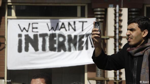 Man in front of we want Internet sign