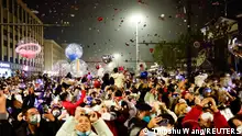 People release balloons as they gather to celebrate New Year's Eve, amid the coronavirus disease (COVID-19) outbreak, in Wuhan, Hubei province, China January 1, 2023. REUTERS/Tingshu Wang
