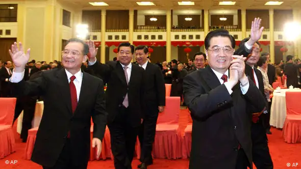 In this photo released by China's Xinhua News Agency, Chinese President Hu Jintao, second right, Premier Wen Jiabao, left, and other top leaders of the country attend a gathering to mark Chinese New Year hosted by the Central Committee of the Communist Party of China (CPC) and the State Council in Beijing Tuesday, Feb. 1, 2011. Chinese leaders on Tuesday offered their Spring Festival greetings to people across the nation at the gathering. (AP Photo/Xinhua, Lan Hongguang) NO SALES