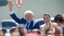 President-elect Luiz Inacio Lula da Silva waves after departing with his wife Rosangela Silva from the Metropolitan Cathedral to Congress for their swearing-in ceremony, in Brasilia, Brazil, Sunday, Jan. 1, 2023. (AP Photo/Gustavo Moreno)