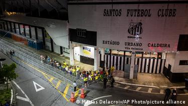 Fans wait outside Santos' stadium ahead of Pele's funeral