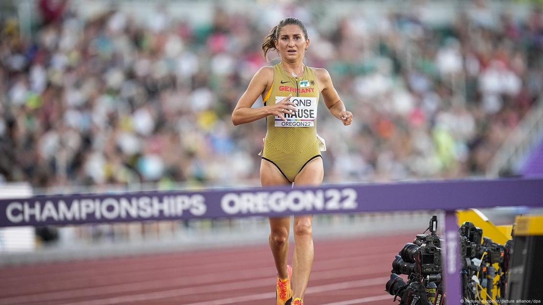 German steeplechaser Gesa Krause running towards a barrier