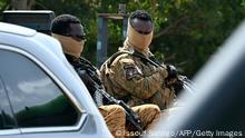 08.10.2022
Soldiers guard the General Sangoule Lamizana military camp in Ouagadougou on October 8, 2022, during the funerals of 27 soldiers killed as they escorted 207-vehicles in a convoy in Gaskinde. - The ambush of the convoy, claimed by Al-Qaeda, officially killed 37 people, including 27 soldiers. Seventy truck drivers remain missing, according to their union. The disaster has become a symbol of the state's inability to secure remote countryside areas and protect local people, 10 years into a bloody jihadist insurgency in the Sahel region. Five days later, Burkina was rocked its second coup in less than nine months -- the fifth in two years in the landlocked West African region. (Photo by Issouf SANOGO / AFP) (Photo by ISSOUF SANOGO/AFP via Getty Images)