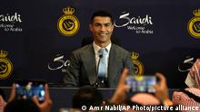 Cristiano Ronaldo smiles during a press conference for his official unveiling as a new member of Al Nassr soccer club in in Riyadh, Saudi Arabia, Tuesday, Jan. 3, 2023. Ronaldo, who has won five Ballon d'Ors awards for the best soccer player in the world and five Champions League titles, will play outside of Europe for the first time in his storied career. (AP Photo/Amr Nabil)