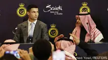 Soccer Football - Al Nassr unveil new signing Cristiano Ronaldo - Mrsool Park, Riyadh, Saudi Arabia - January 3, 2023 President of Al Nassr Musalli Al-Muammar with new signing Cristiano Ronaldo during the press conference REUTERS/Ahmed Yosri