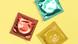 Condoms in different colored wrappers Condoms in different colored wrappers