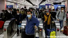 Hong Kong, China, January 8, 2023. Travellers arrive at Hong Kong's Lok Ma Chau border checkpoint on the first day China reopens the border amid the coronavirus disease (COVID-19) pandemic in Hong Kong, China, January 8, 2023. REUTERS/Tyrone Siu