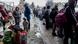 Ukrainians stand at a train station in Poland ahead of traveling to Ukraine for the Christmas season Ukrainians stand at a train station in Poland ahead of traveling to Ukraine for the Christmas season