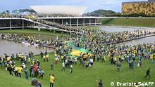 Supporters of Brazilian former President Jair Bolsonaro hold a demonstration at the Esplanada dos Ministerios in Brasilia on January 8, 2023. (Photo by EVARISTO SA / AFP)
