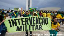 08.01.2023
Protesters, supporters of Brazil's former President Jair Bolsonaro, hold a banner that reads in Portuguese Military Intervention as they storm the the National Congress building in Brasilia, Brazil, Sunday, Jan. 8, 2023. (AP Photo/Eraldo Peres)