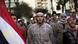 Protesters walking down street, Egyptian flag Protesters walking down street, Egyptian flag