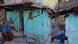 A woman in Joshimath looks at her house which suffered large cracks due to land subsidence. A woman in Joshimath looks at her house which suffered large cracks due to land subsidence.