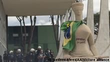 BRASILIA, BRAZIL - JANUARY 08: A view of Lady Justice Statue at the supreme court as supporters of former President Jair Bolsonaro clash with security forces after raiding governmental buildings in Brasilia, Brazil, 08 January 2023. Groups shouting slogans demanding intervention from the army broke through the police barrier and entered the Congress building, according to local media. Police intervened with tear gas to disperse pro-Bolsonaro protesters. Bolsonaro supporters also managed to invade and ransack the National Congress, Planalto Palace, or President's office, and the Supreme Federal Court. Joedson Alves / Anadolu Agency