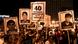 Protesters show pictures of people killed in the response to demonstrations Protesters show pictures of people killed in the response to demonstrations