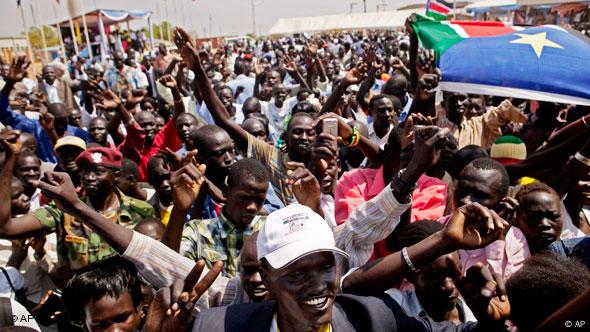 Crowds of South Sudanese wave flags and celebrate Crowds of South Sudanese wave flags and celebrate