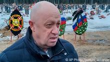 Wagner Group head Yevgeny Prigozhin attends the funeral of Dmitry Menshikov, a fighter of the Wagner group who died during a special operation in Ukraine, at the Beloostrovskoye cemetery outside St. Petersburg, Russia, Saturday, Dec. 24, 2022. (AP Photo)