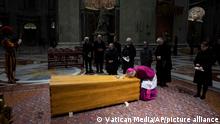 05.01.2023
In this image released on Thursday, Jan. 5, 2023, by the Vatican Media news service, Bishops Georg Gaenswein, right, kisses the cypress casket containing the body of Pope Emeritus Benedict XVI in St. Peter's Basilica, Wednesday, Jan. 4, 2023, the night before his funeral mass presided over by Pope Francis at the Vatican. Benedict died at 95 on Dec. 31 in the monastery on the Vatican grounds where he had spent nearly all of his decade in retirement. He was 95. (Vatican Media via AP)