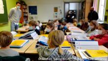 02/09/2021 FILE-Students attend class on the first day of school for the 2021-2022 year at Gounod Lavoisier Primary school in Lille, northern France, Thursday, Sept. 2 2021. Less than two weeks after the winter term started, French teachers are already exhausted by the pressures of surging COVID-19 cases and they are walking out in nationwide strike organized by their unions to protest virus-linked class disruptions and ever-changing isolation rules. (AP Photo/Michel Spingler, File)
