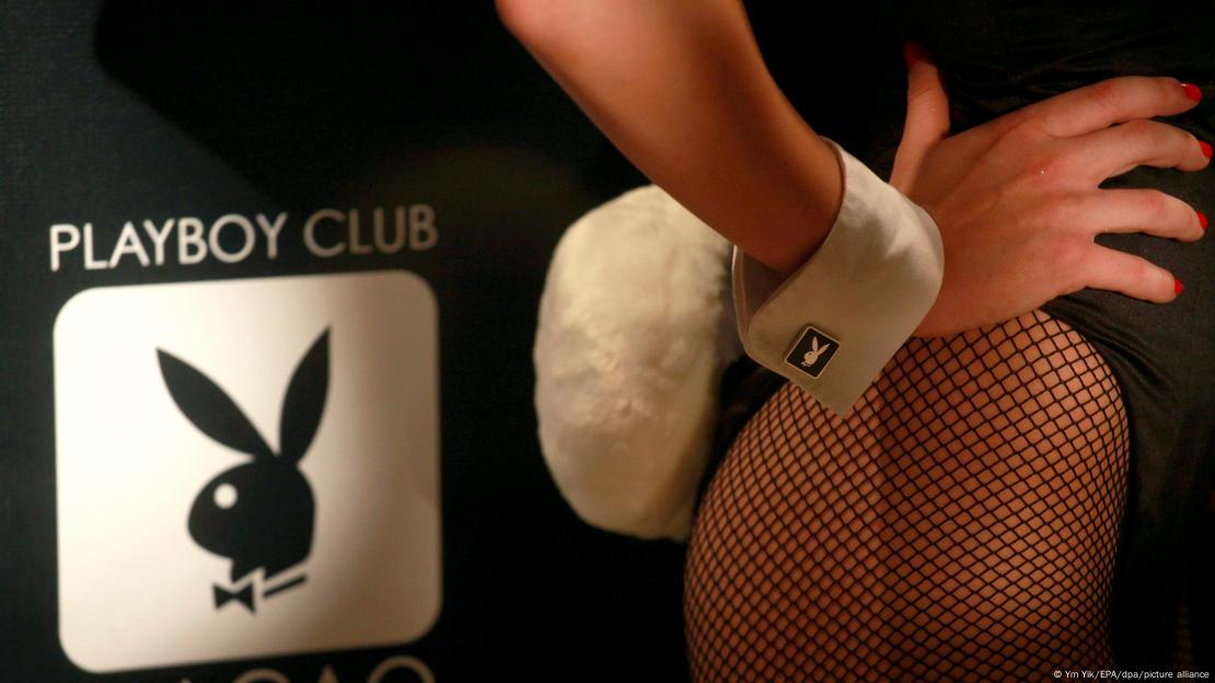 Picture of the logo of the Playboy Club and a woman wearing fishnet stockings with a bunny tail attached to her back.