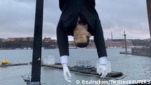 A puppet of Turkish President Tayyip Erdogan is hung by its feet during a demonstration in Stockholm, Sweden, January 12, 2023, in this image obtained from social media. Twitter @realrojkom/via REUTERS THIS IMAGE HAS BEEN SUPPLIED BY A THIRD PARTY. NO RESALES. NO ARCHIVES