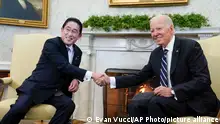President Joe Biden shakes hands with Japanese Prime Minister Fumio Kishida as they meet in the Oval Office of the White House, Friday, Jan. 13, 2023, in Washington. (AP Photo/Evan Vucci)