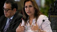Peru's President Dina Boluarte speaks during a press conference with foreign press, accompanied by Prime Minister Alberto Otarola, at the Presidential Palace in Lima, Peru, Thursday, Dec. 29, 2022. (AP Photo/Martin Mejia)