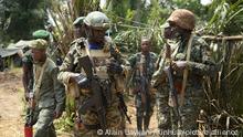 09.12.2021***(211209) -- BENI (DRC), Dec. 9, 2021 (Xinhua) -- Soldiers from Uganda and the Democratic Republic of the Congo (DRC) carry out a joint military operation against armed forces in Beni territory, northeastern DRC, on Dec. 8, 2021. At the front-line against armed forces in northeastern Democratic Republic of the Congo (DRC), Major General Kayanja Muhanga of the Ugandan army (UPDF), has stated his determination to destroy once and for all the rebels of the Allied Democratic Forces (ADF), a nightmare for the African Great Lakes region. (Photo by Alain Uaykani/Xinhua) TO GO WITH Interview: We will destroy ADF rebels once and for all: Ugandan commander
