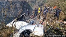 Rescue teams work to retrieve bodies at the crash site of an aircraft carrying 72 people in Pokhara in western Nepal January 15, 2023. Bijay Neupane/Handout via REUTERS THIS IMAGE HAS BEEN SUPPLIED BY A THIRD PARTY. MANDATORY CREDIT. NO RESALES. NO ARCHIVES. TPX IMAGES OF THE DAY 
