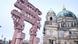 A replica of ancient Indian gate in front of the Berlin Cathedral in red sandstone A replica of ancient Indian gate in front of the Berlin Cathedral in red sandstone