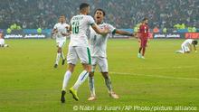 Iraq's Ibrahim Bayesh, right, celebrates with teammates after scoring their opening goal the Arabian Gulf Cup's semifinal football match between Iraq and Qatar at the Basra International Stadium in Basra, Iraq, Monday, Jan.16, 2023. (AP Photo/Nabil al-Jurani)