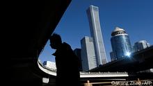 16.01.2023
A pedestrian walks at Central Business District (CBD) in Beijing on January 16, 2023. (Photo by WANG Zhao / AFP)