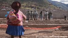 TOPSHOT - Police repel protesters from taking the airport grounds in the Andes city of Cusco, Peru, on January 19, 2023. - After weeks of unrest, thousands of protesters were expected to descend on Peru's capital Lima, defying a state of emergency to express their anger with President Dina Boluarte, who called on the demonstrators to gather peacefully and calmly. The South American country has been rocked by over five weeks of deadly protests since the ouster and arrest of her predecessor Pedro Castillo in early December. (Photo by Ivan Flores / AFP) (Photo by IVAN FLORES/AFP via Getty Images)