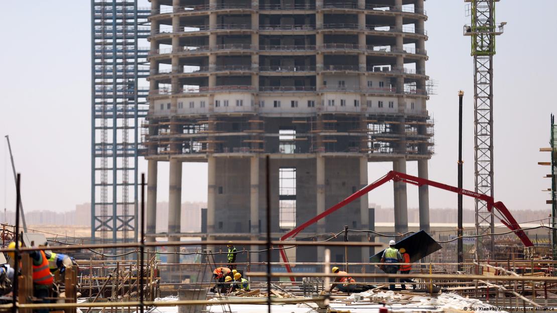 People work at a construction site of the central business district (CBD) project in Egypt's new administrative capital.