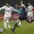 Real Madrid's Mesut Özil, left, competes for the ball with Lyon's Jeremy Toulalan